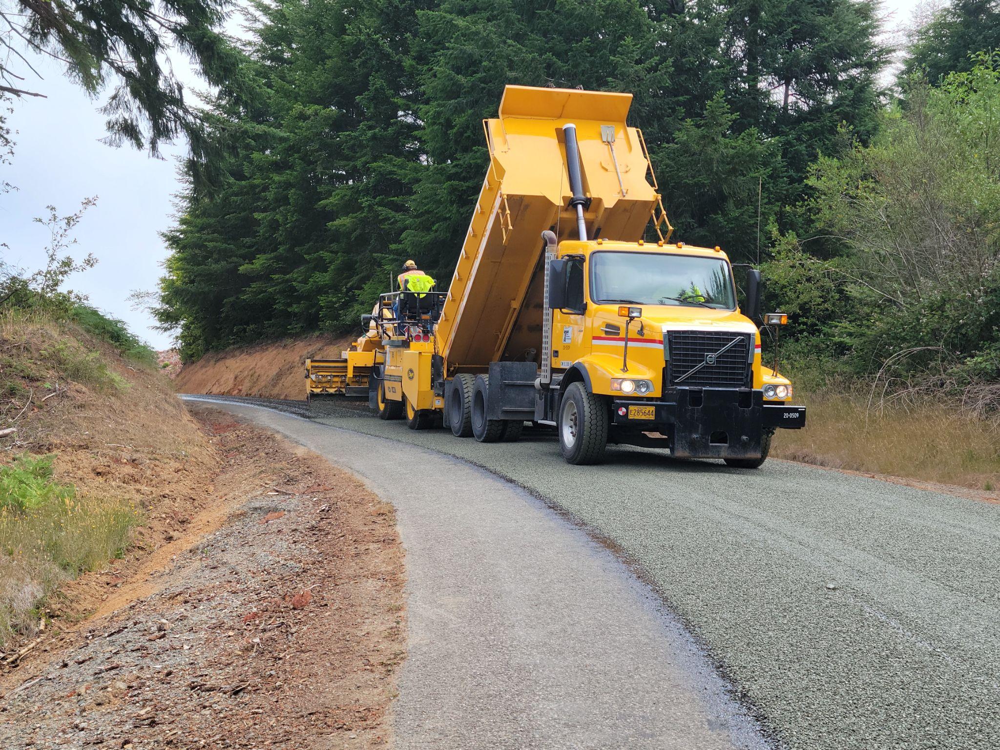 Asphalt roller compacting pavement