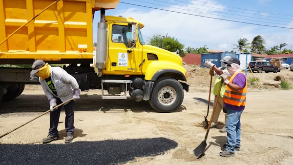 Residential asphalt driveway grading and drainage inspection.