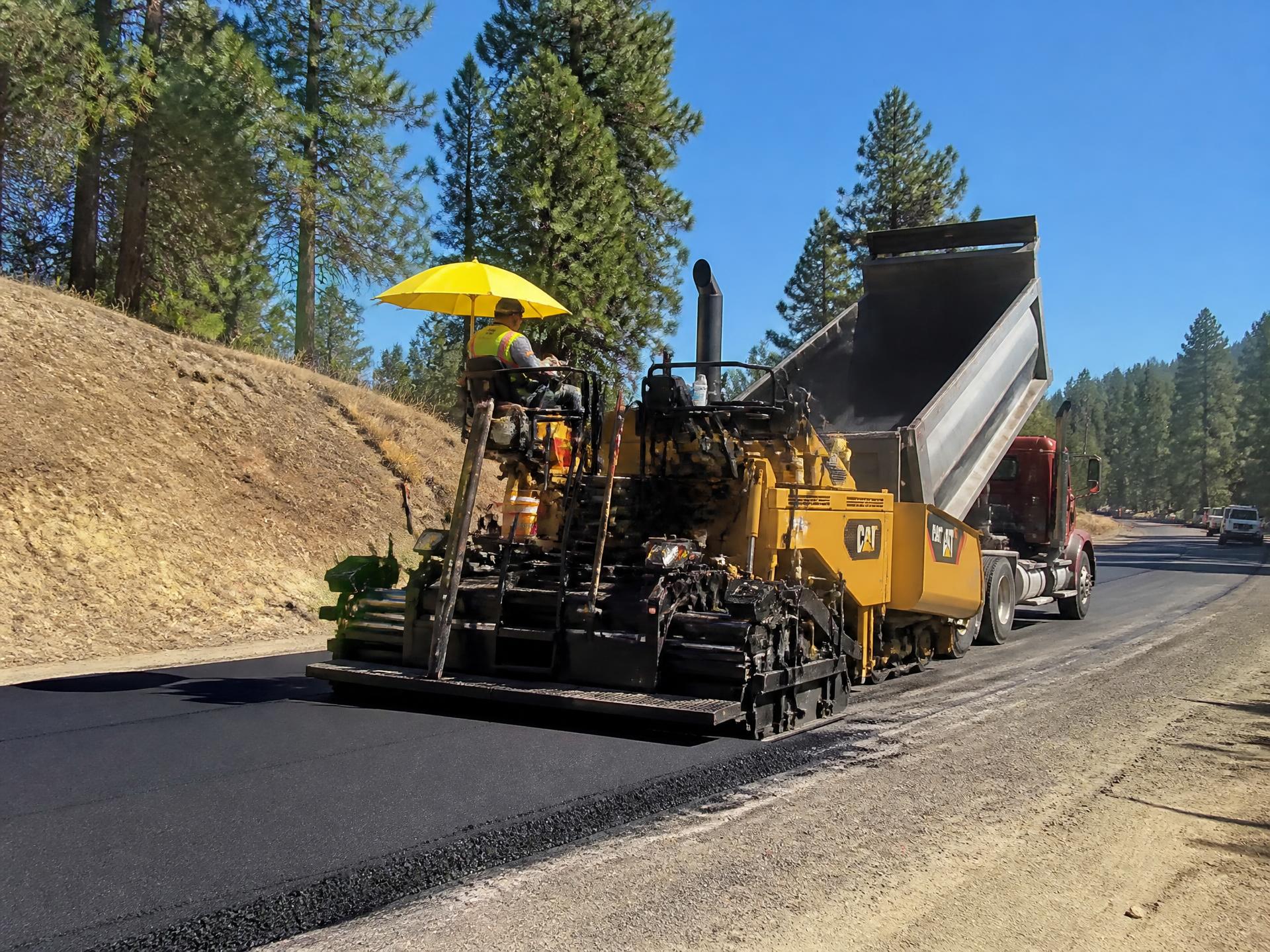 Asphalt paving contractor preparing a California pavement surface
