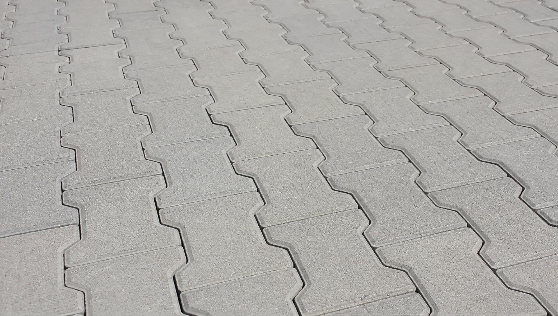Durable stone-paved surface representing professional industrial asphalt paving in California